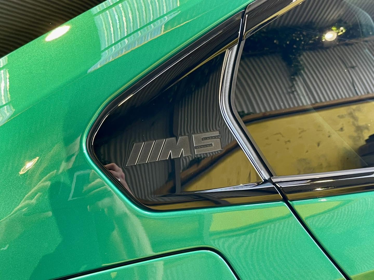 Close-up of the polished green BMW M5 finish