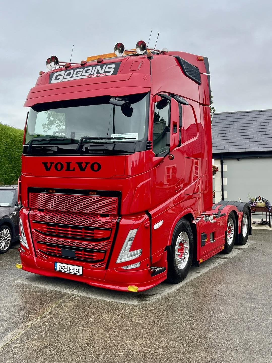 Red Volvo truck with a polished exterior
