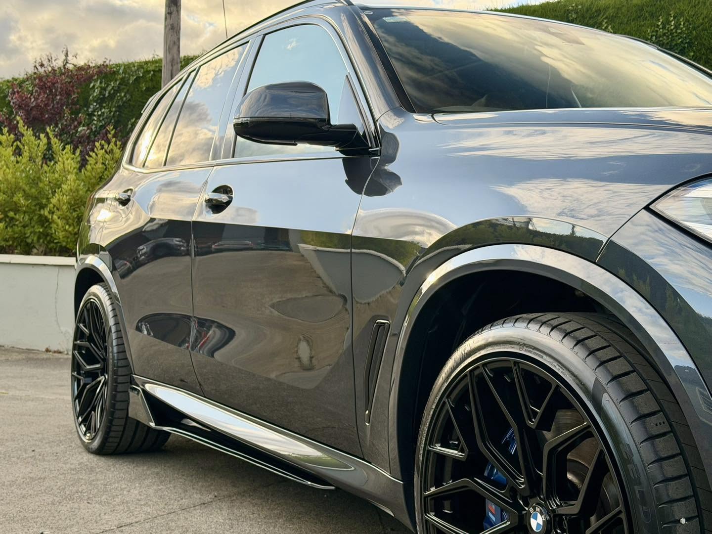 BMW X5 with exterior road grime before a decontamination wash
