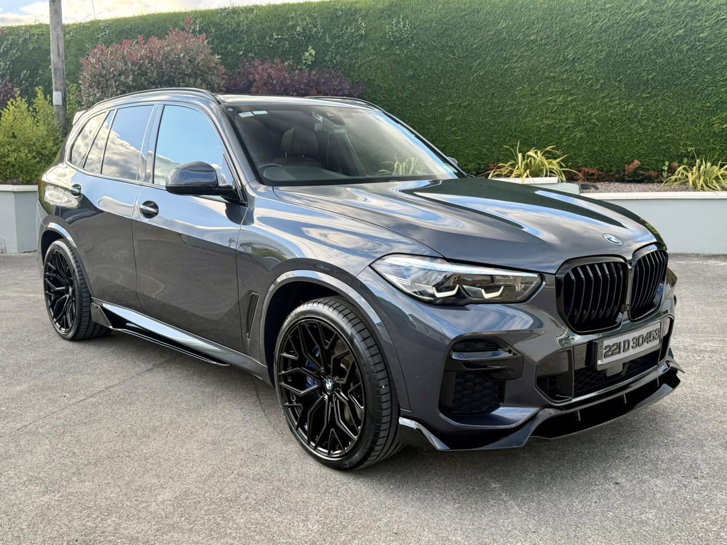 Grey BMW X5 with strong paint reflections